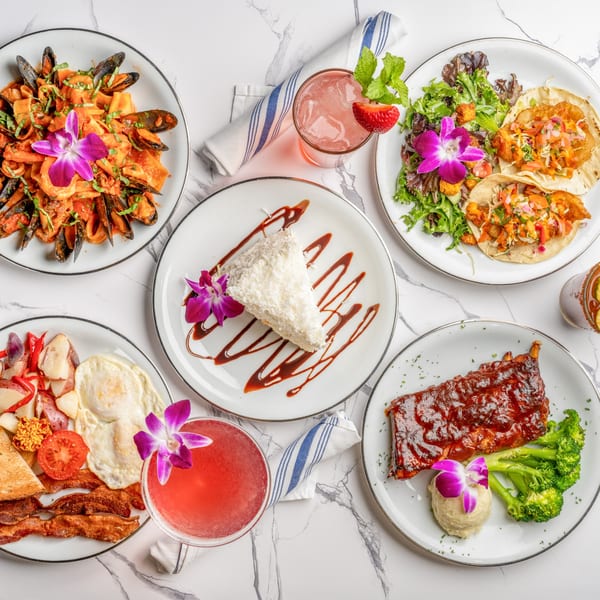 A flat lay of various Italian dishes including pasta, tacos, ribs, breakfast, and dessert.